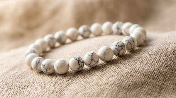 White howlite crystal bracelet on beige linen background