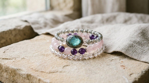 Three-piece crystal jewelry stack with clear quartz, rose quartz, amethyst, and labradorite