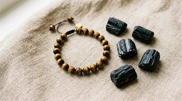 Tiger’s eye bracelet with black tourmaline stones on neutral fabric background